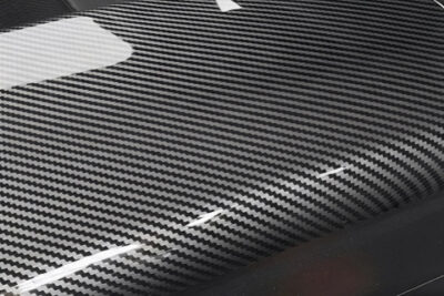 Piesă auto din plastic cu aspect carbon look – imitație vizuală a fibrei de carbon, fără rezistență sau beneficii reale – exemplu tuning aftermarket